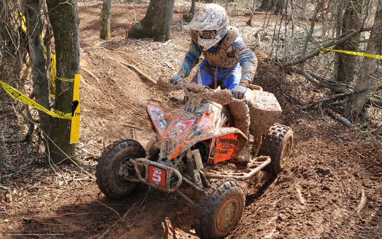 ATV rider on muddy trail