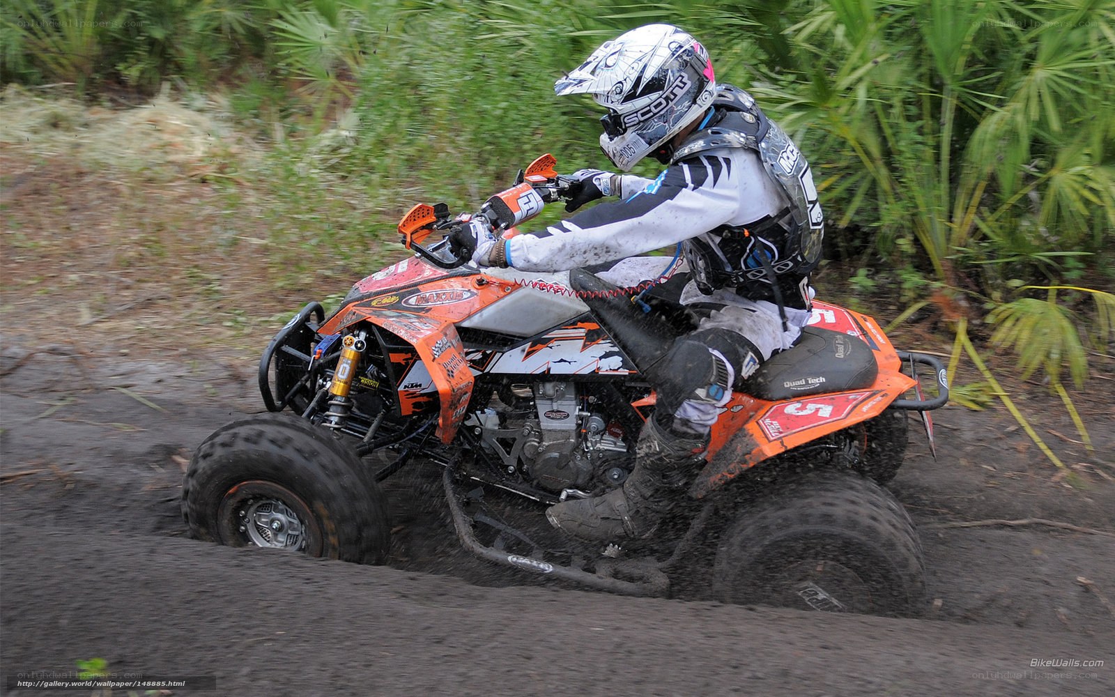 ATV rider on muddy trail