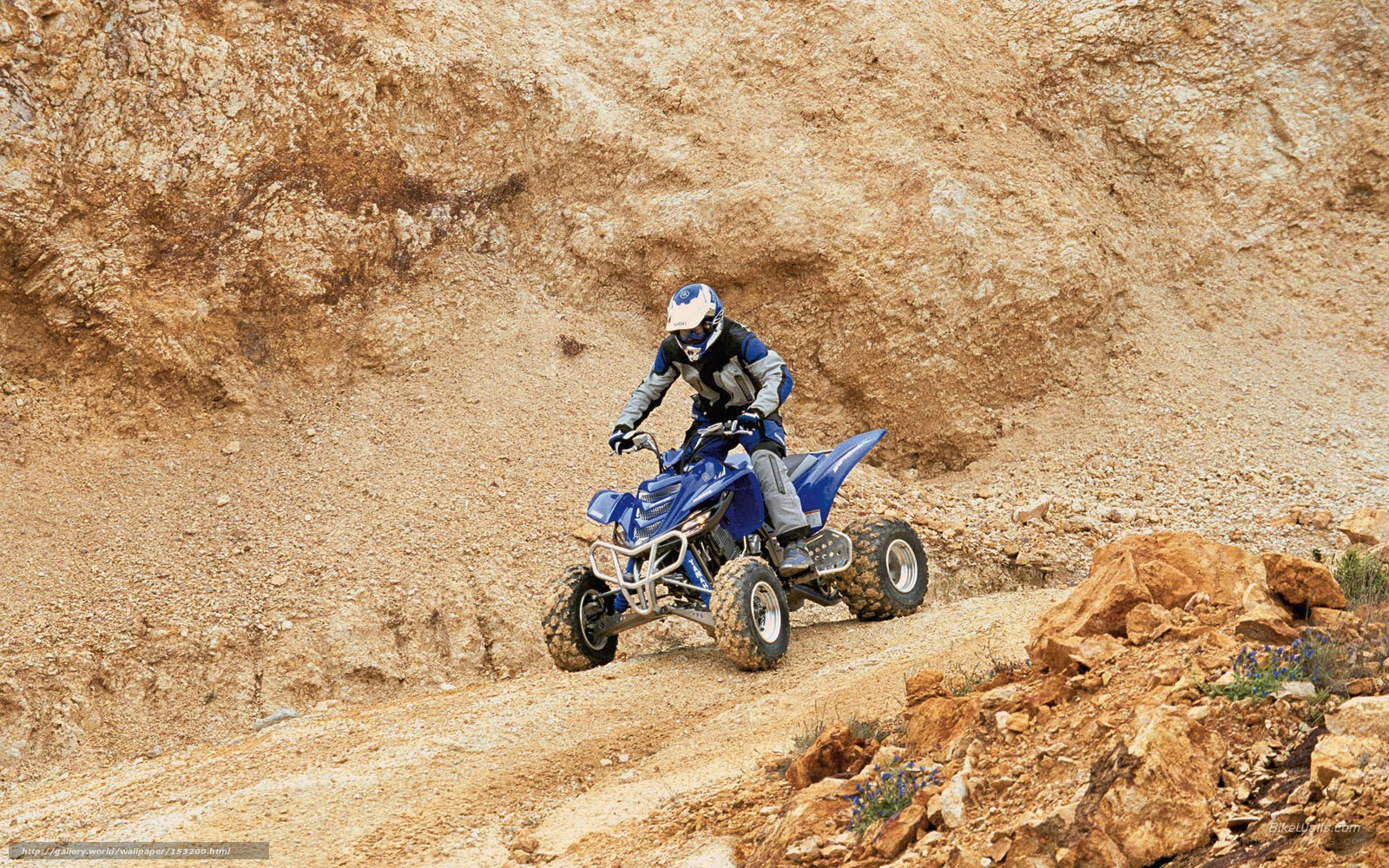 ATV rider on rocky terrain