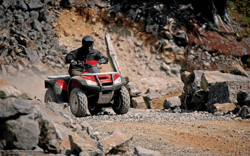 ATV rider on rocky terrain