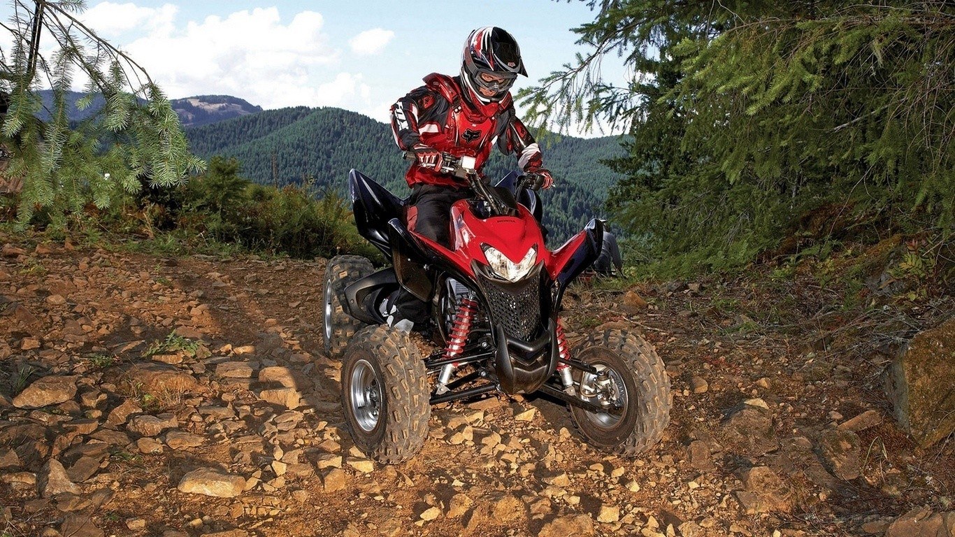ATV rider on rocky trail