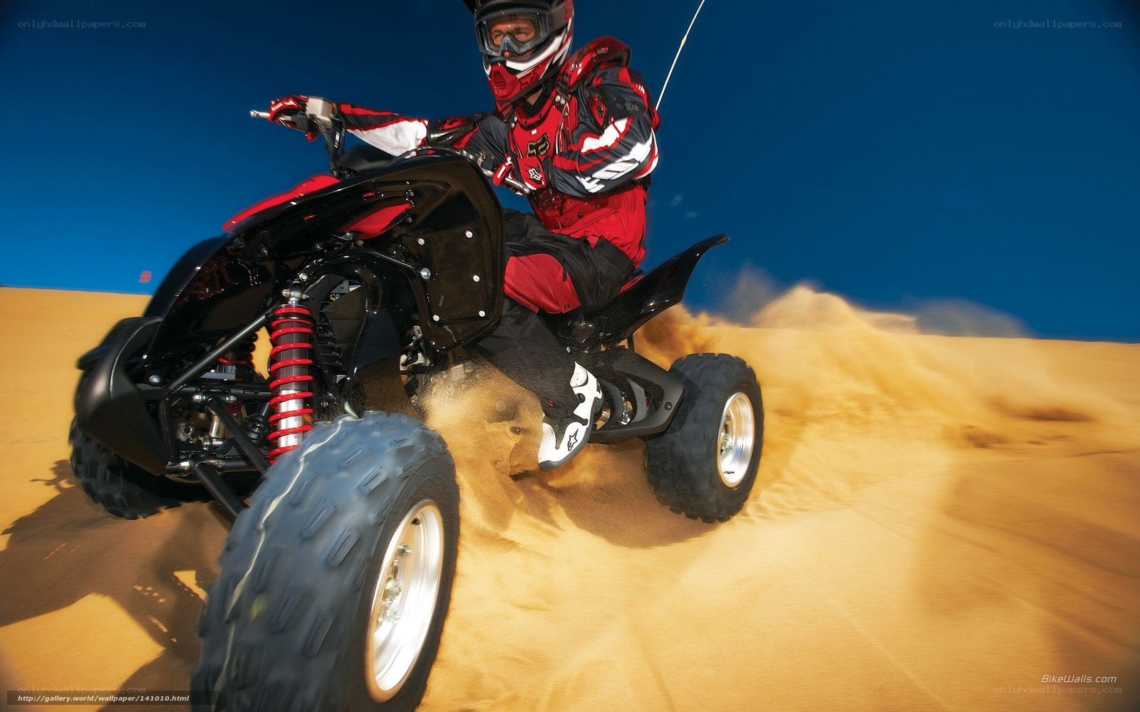 ATV rider on sand dune