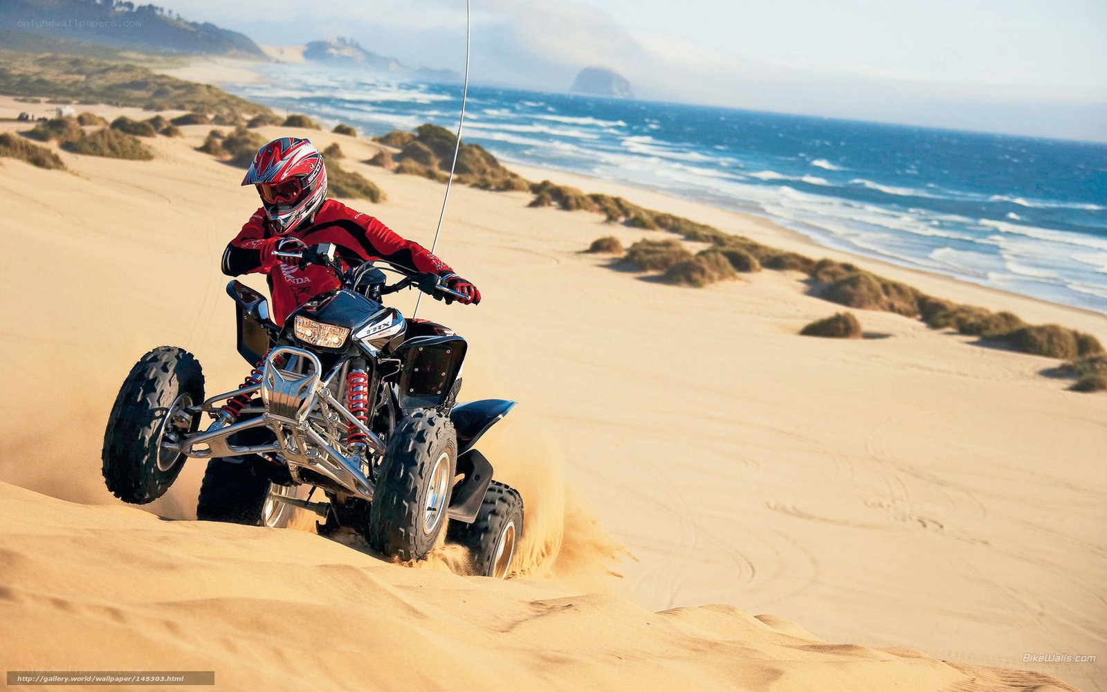 ATV rider on sandy beach