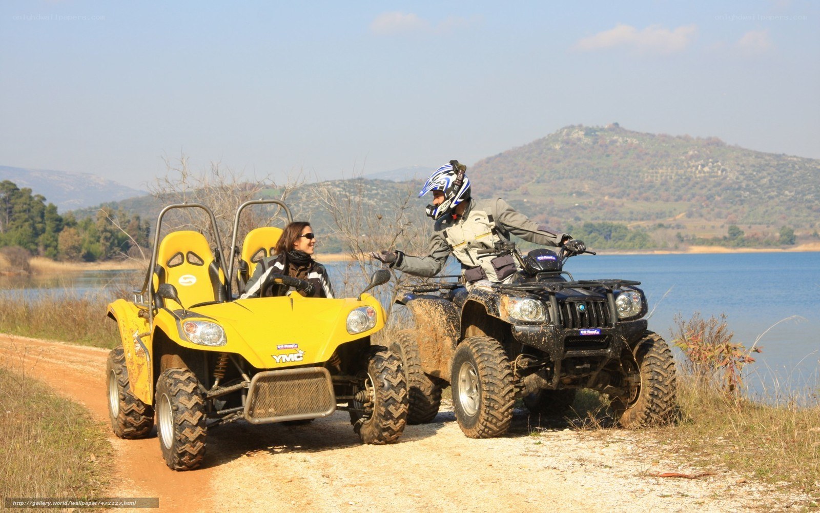 ATV riders by the lake
