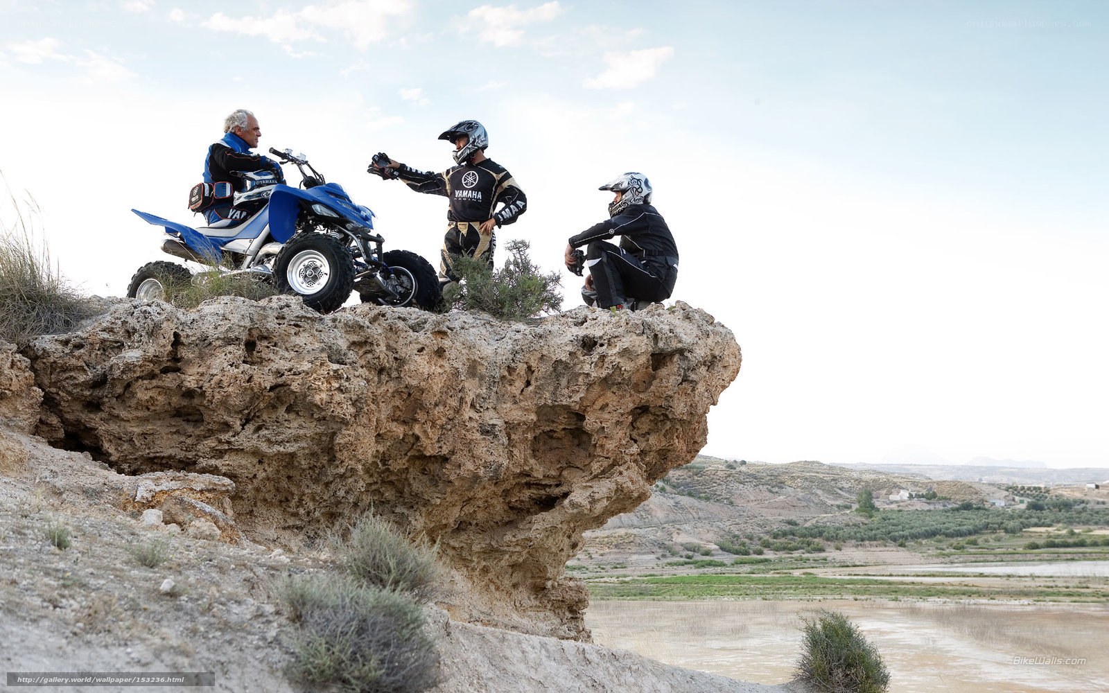 ATV riders on a cliff
