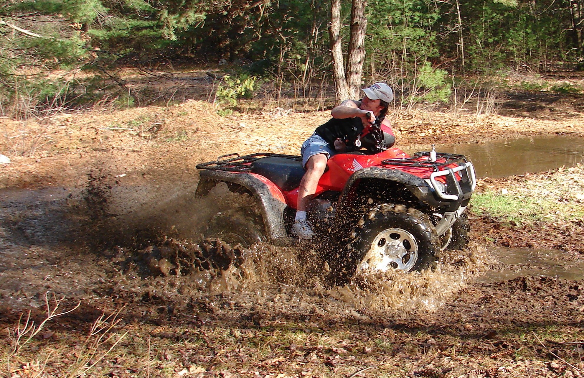 ATV riding through mud