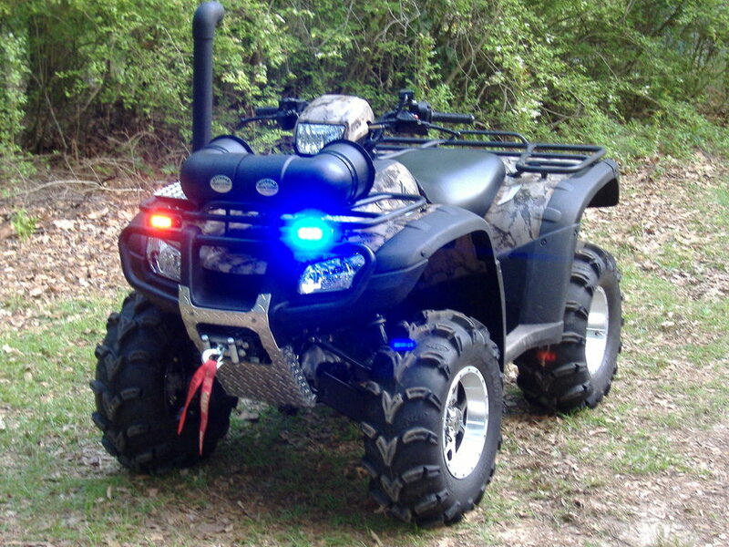 ATV with blue light in woods