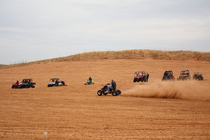 ATVs on a Dirt Field