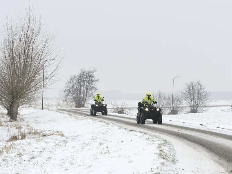 ATVs on Snowy Road