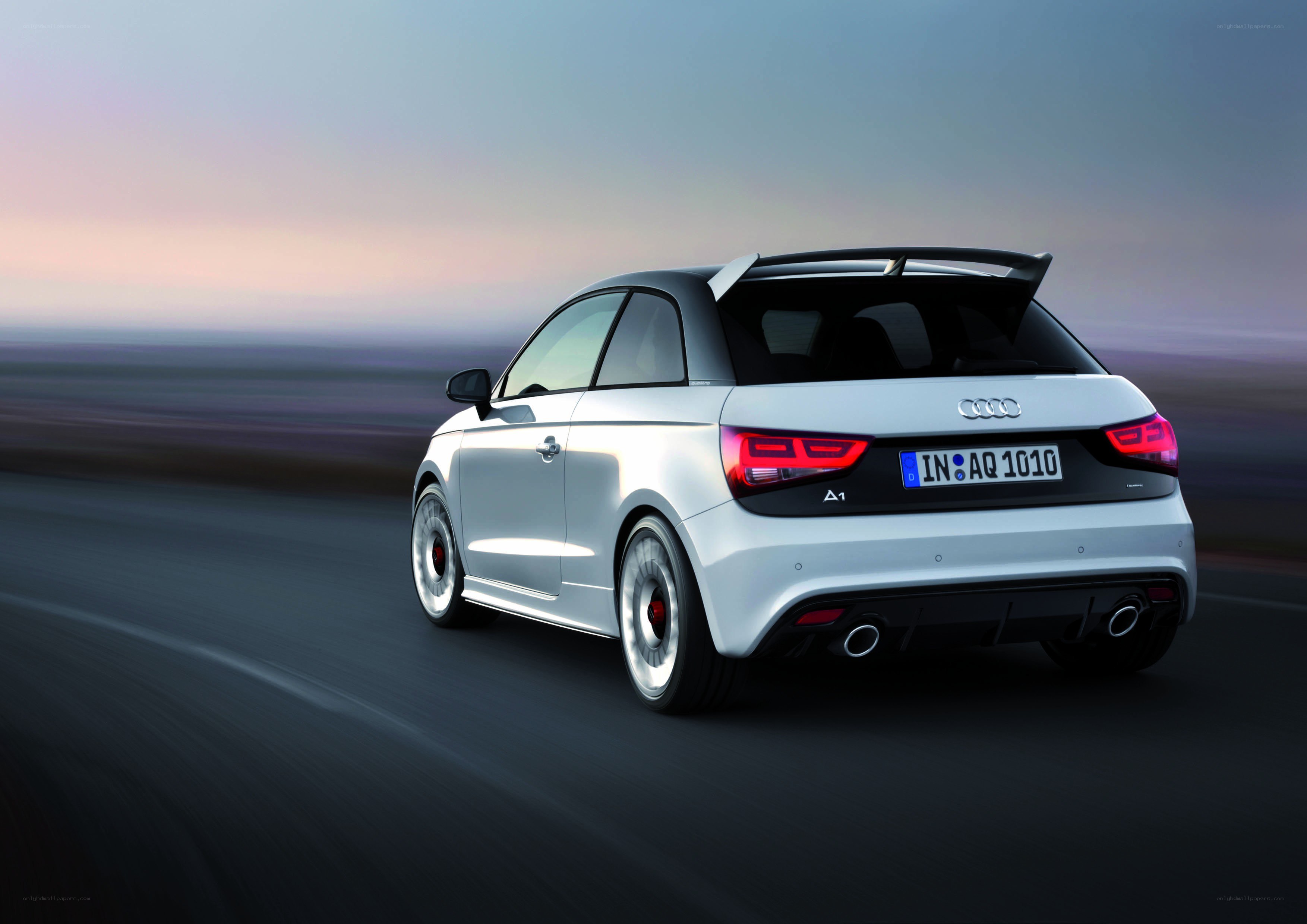 Audi A1 driving on a road