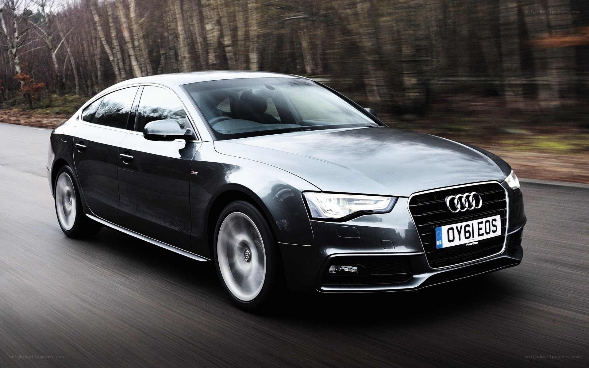 Audi A5 driving on a road