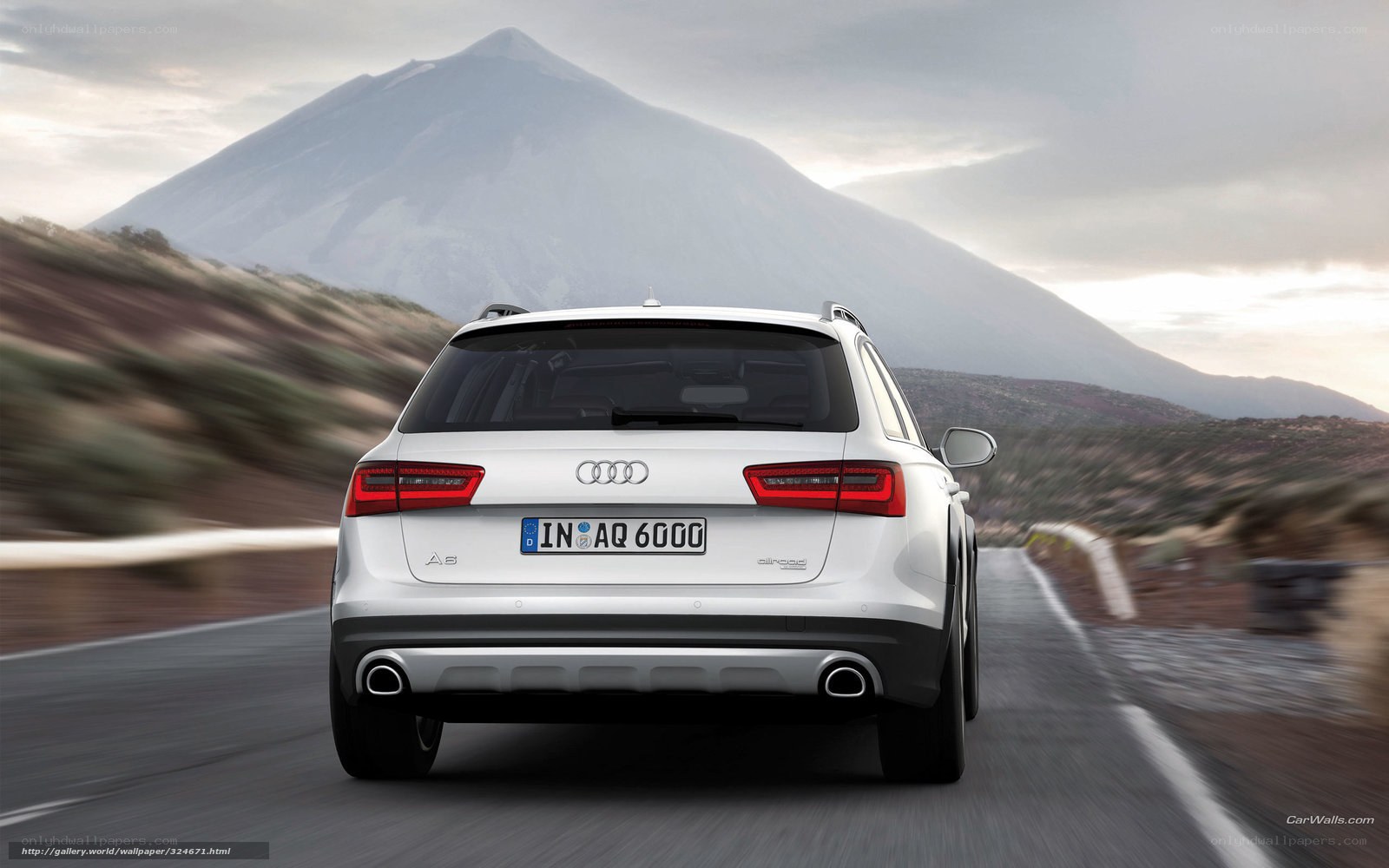 Audi A6 allroad driving on mountain road