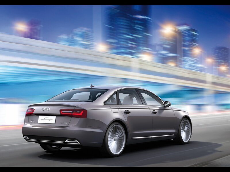 Audi A6 in motion at night