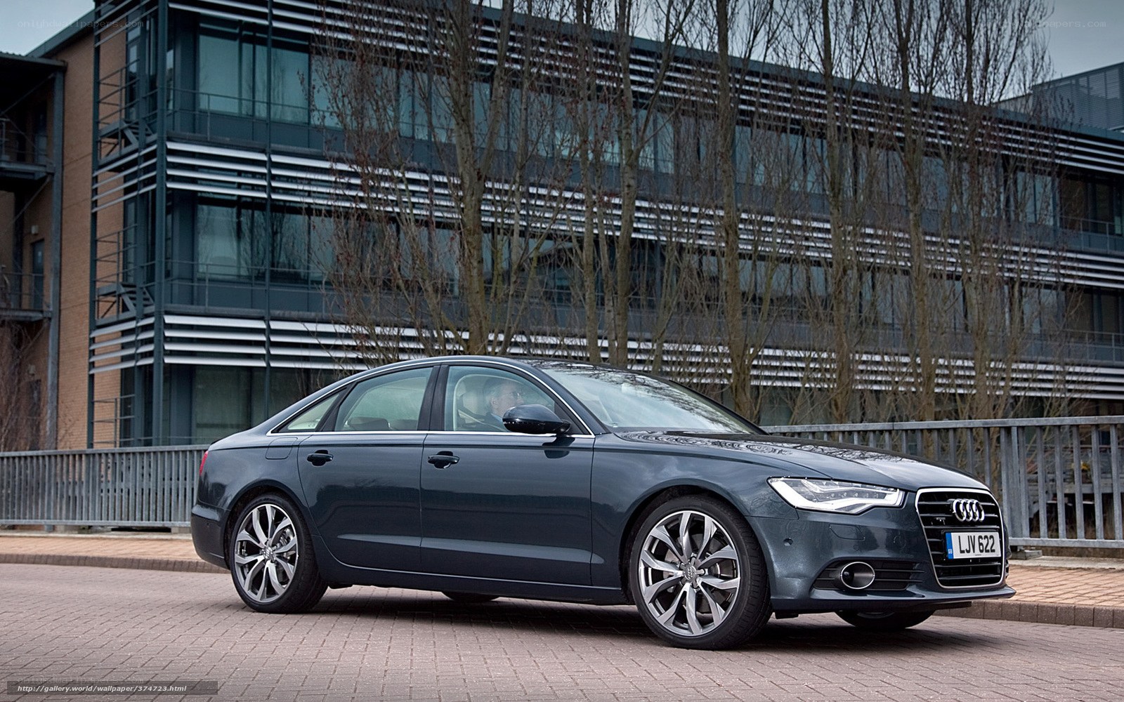 Audi A6 parked outside a building
