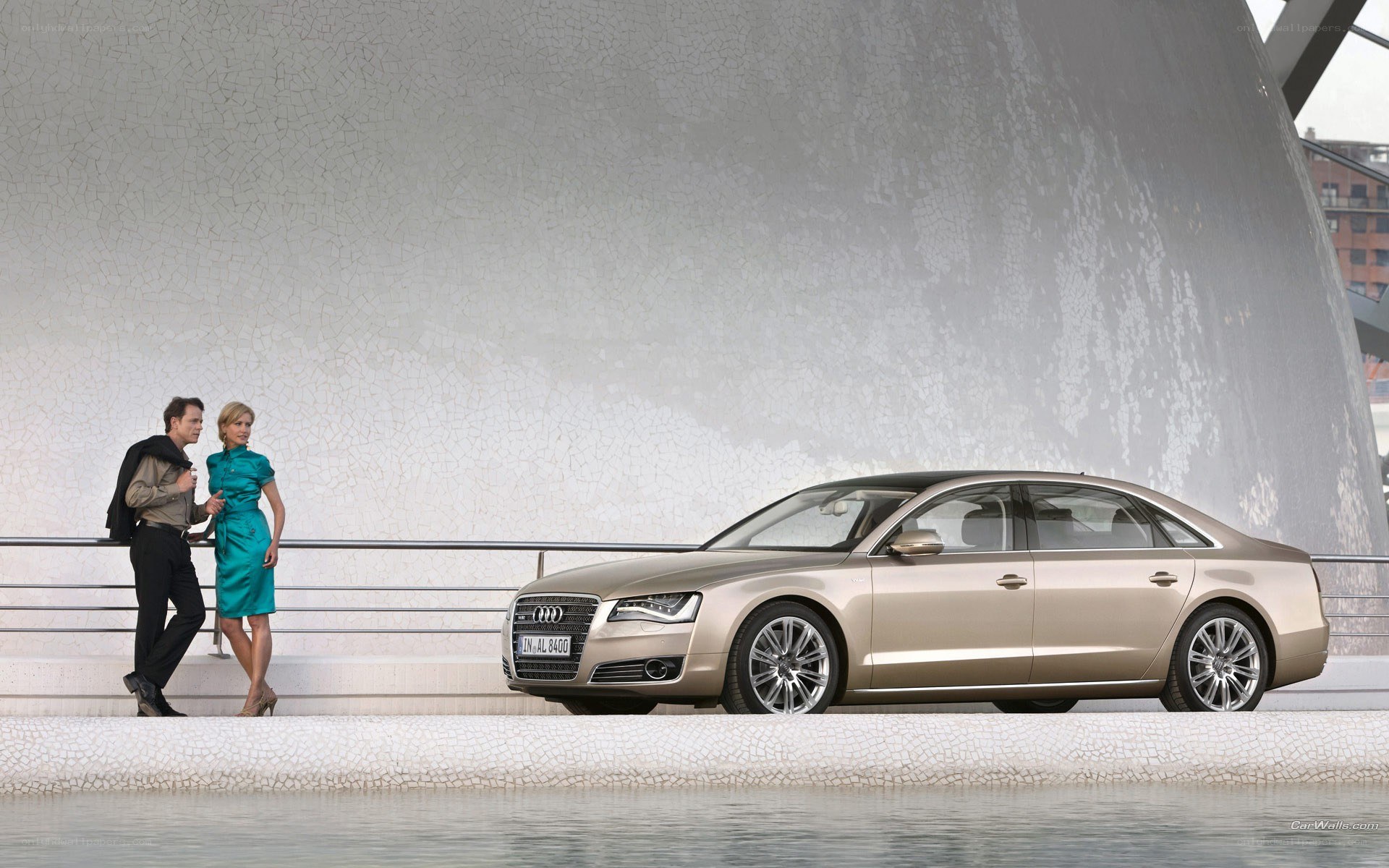 Audi A8 by a modern building