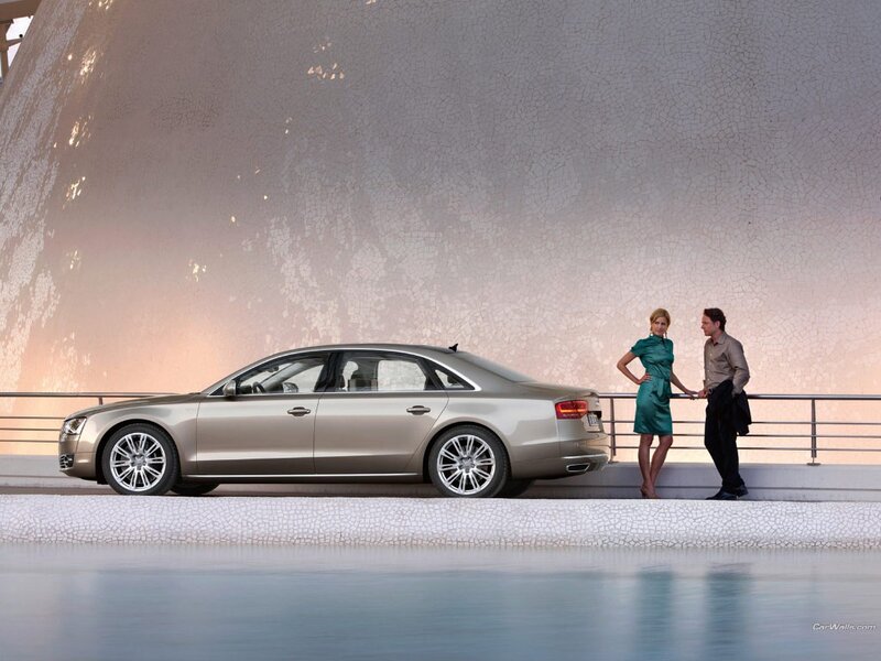Audi A8 by a modern structure