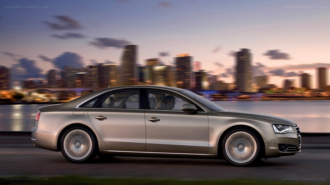 Audi A8 driving at dusk