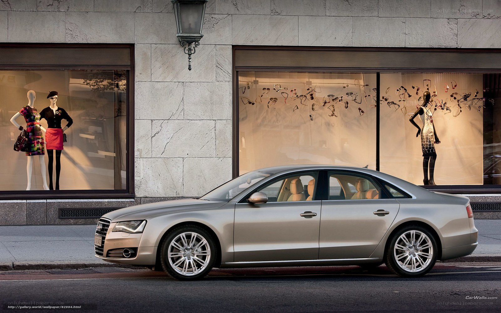 Audi A8 in front of a fashion store