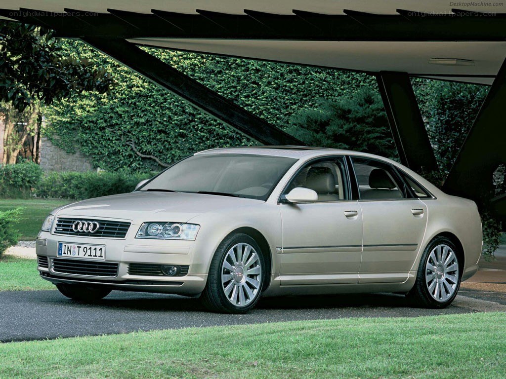 Audi A8 parked under a carport