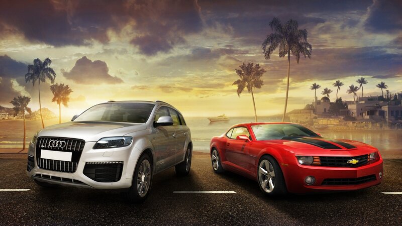 Audi and Chevrolet on a coastal road