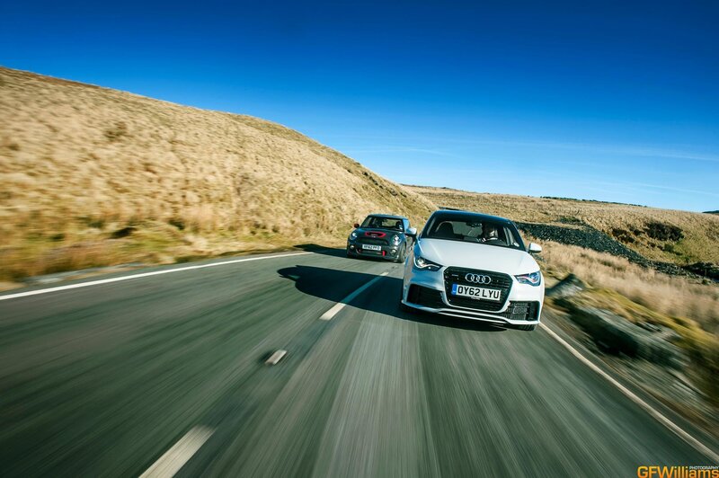 Audi and Mini on a country road