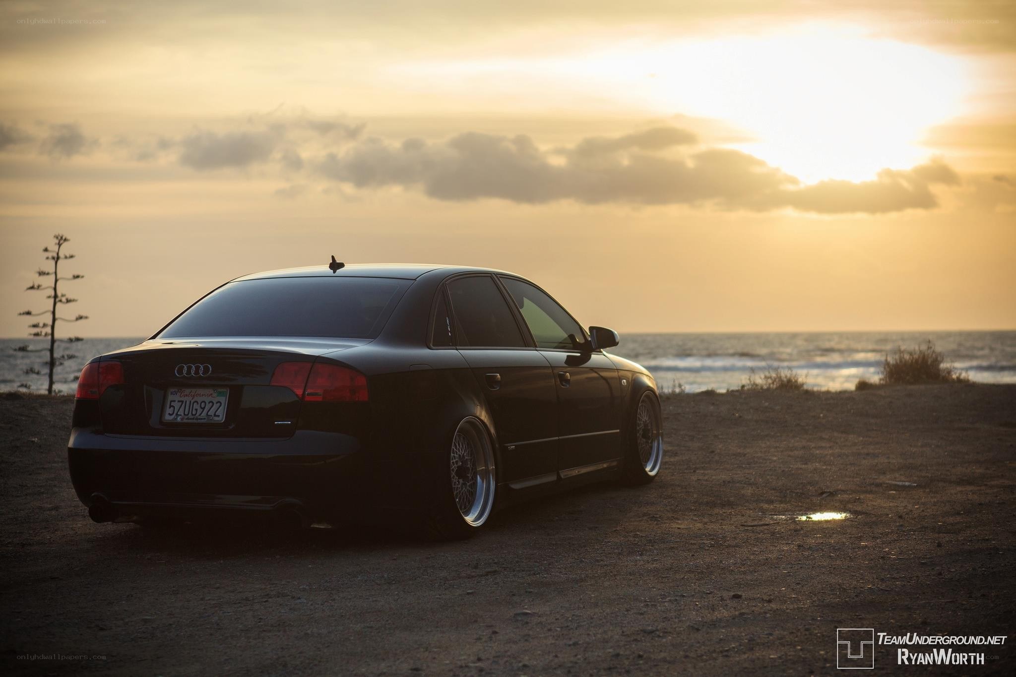 Audi at sunset by the ocean