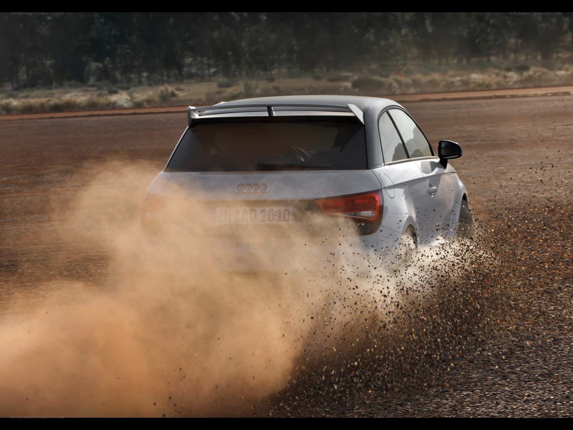 Audi car kicking up dust
