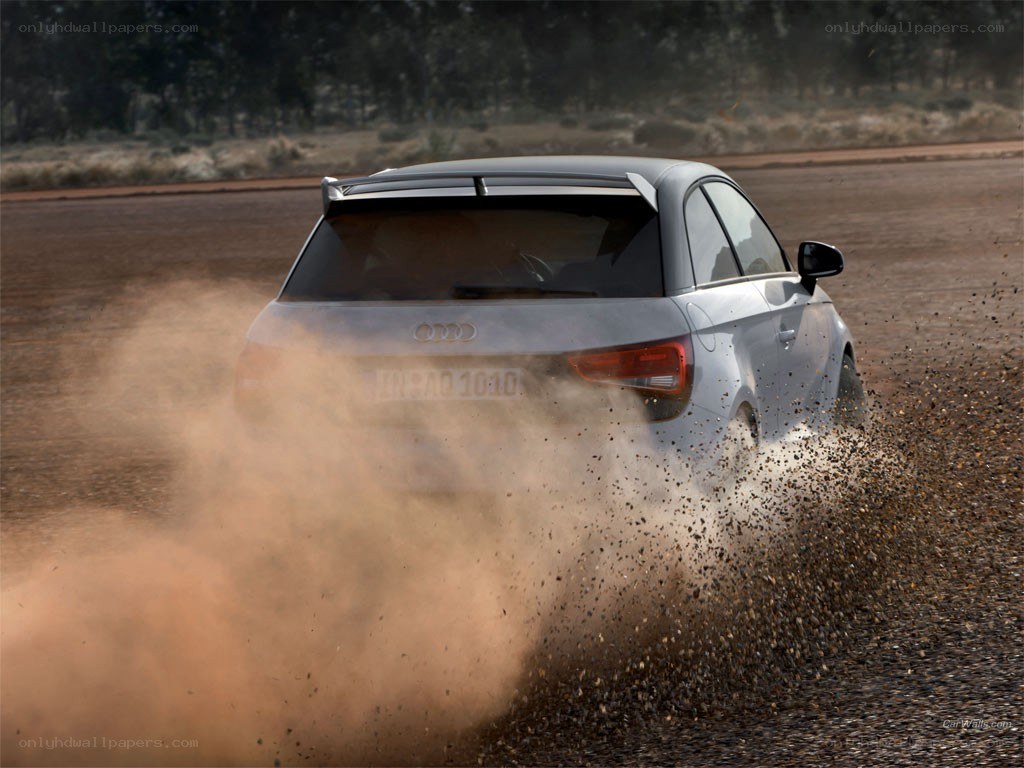 Audi car kicking up dust