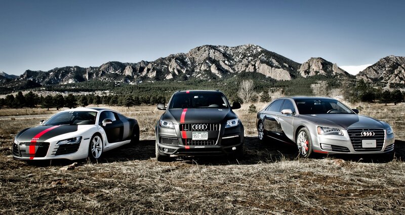 Audi cars in mountain landscape