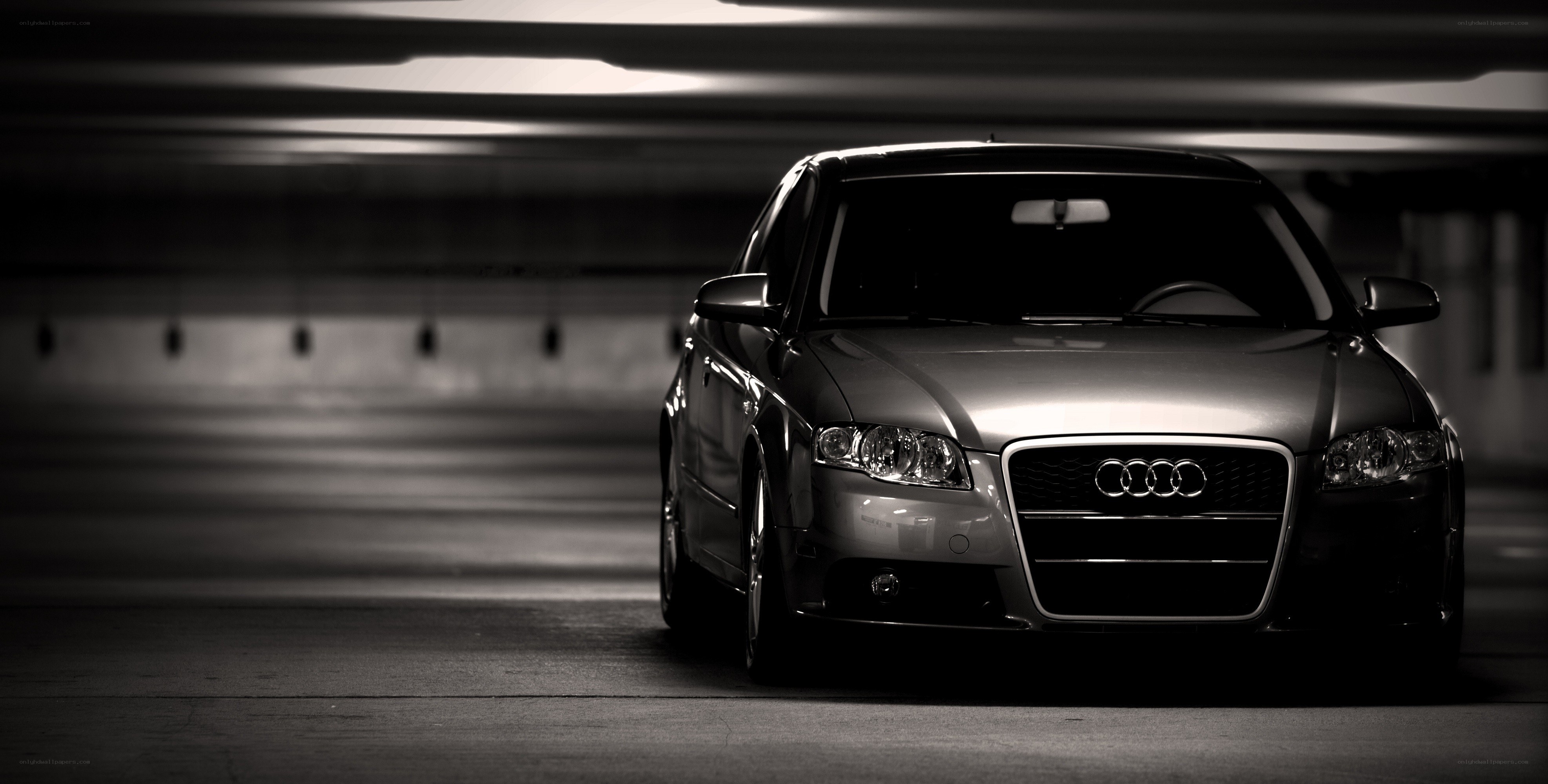 Audi in a dimly lit garage