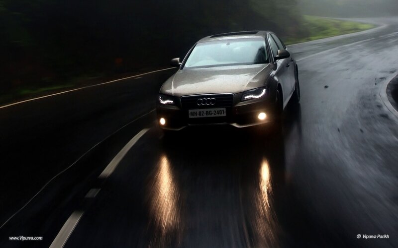 Audi on a wet road at night