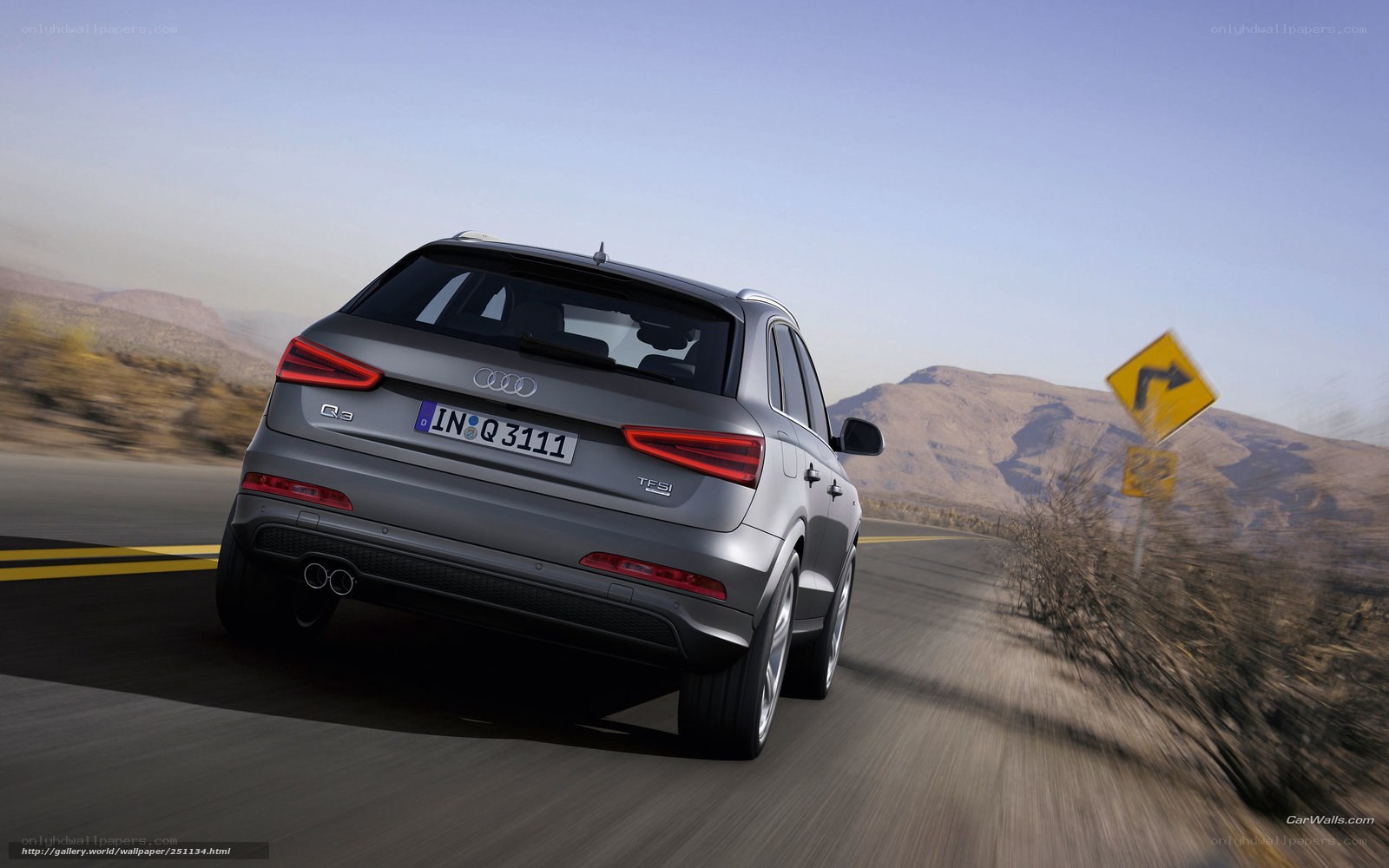 Audi Q3 driving on a road