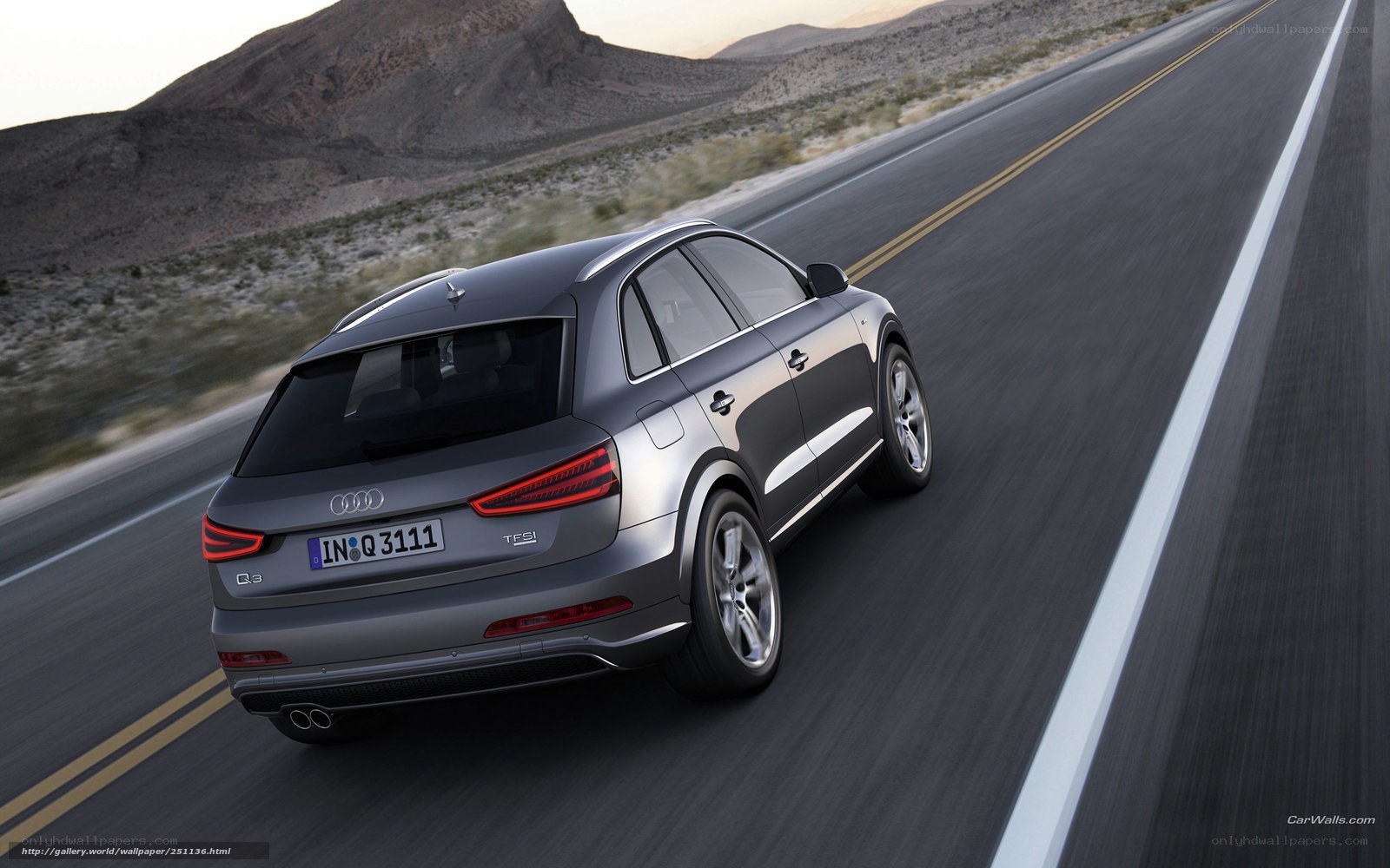 Audi Q3 driving on desert road