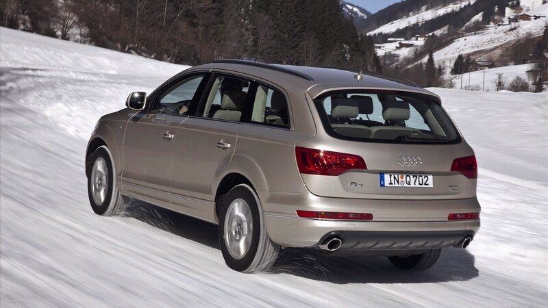 Audi Q7 driving on a snowy road