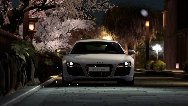 Audi R8 at night under cherry blossoms