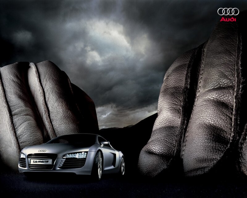 Audi R8 between giant hands