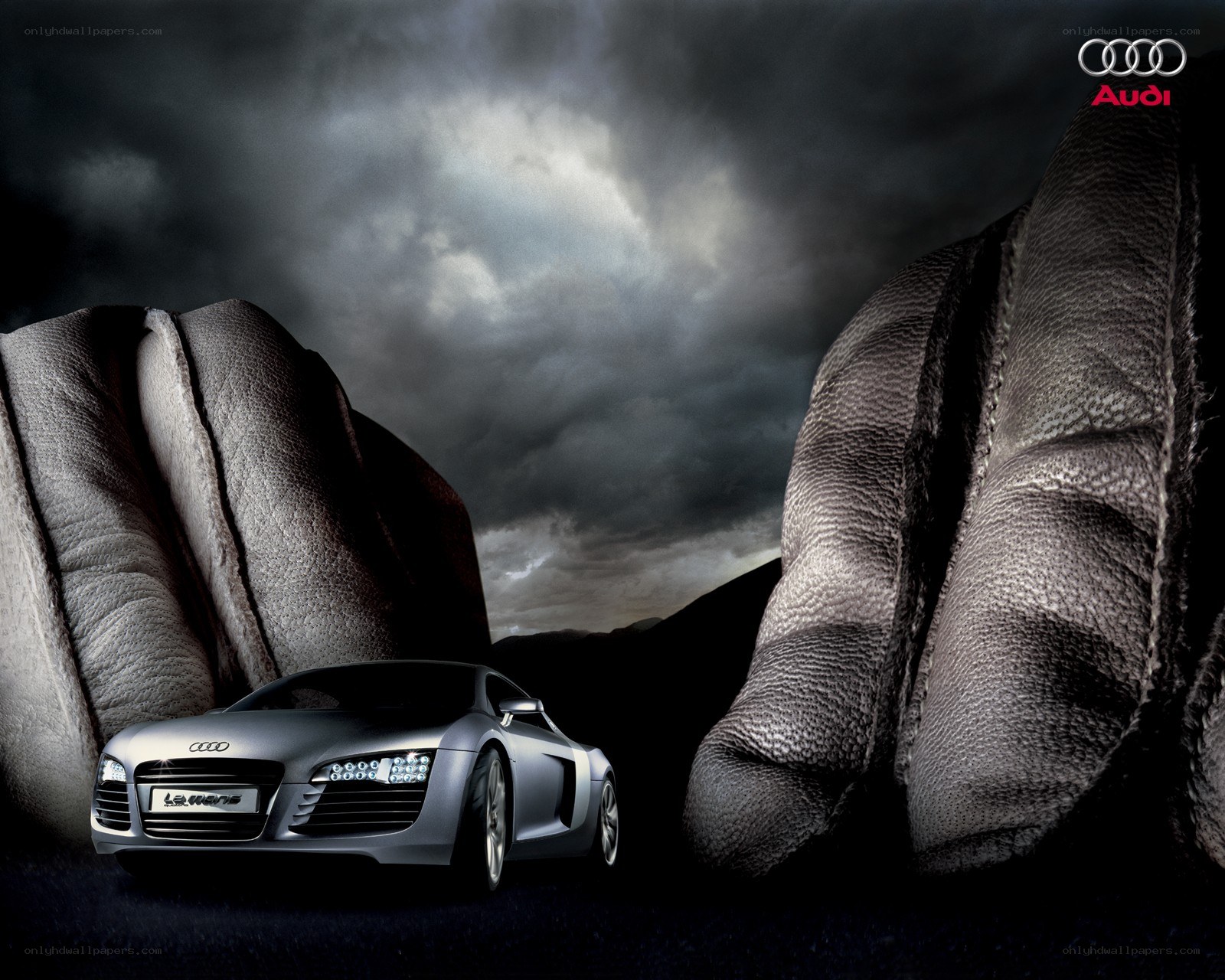 Audi R8 between giant hands
