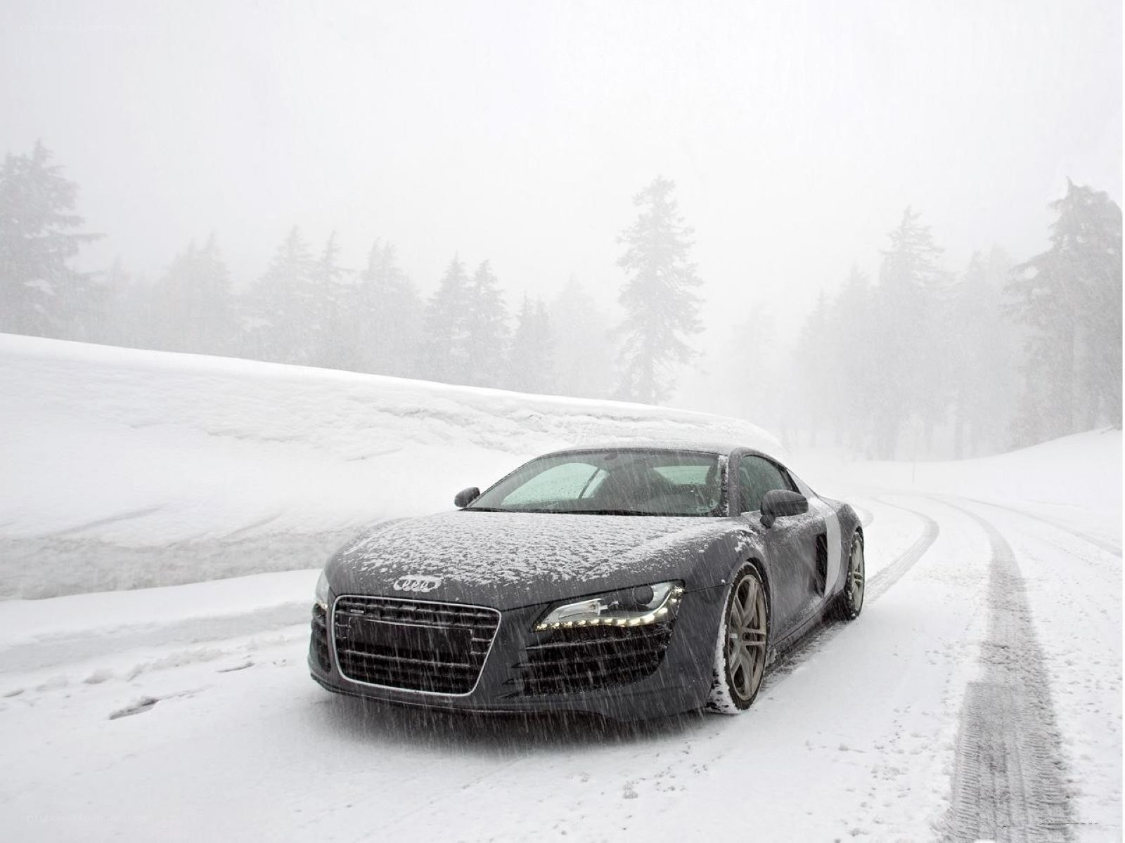 Audi R8 in a snowy forest