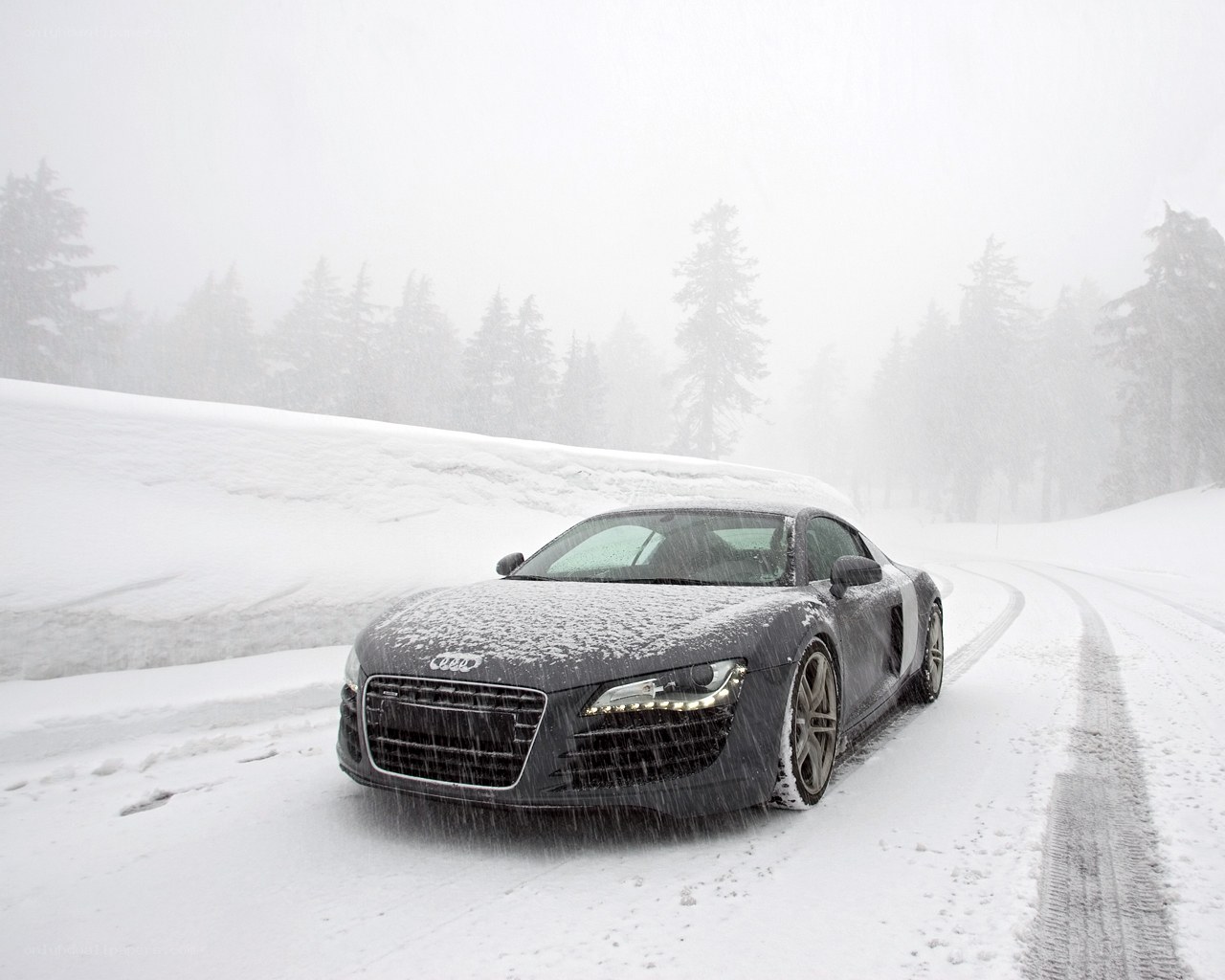 Audi R8 in a snowy forest