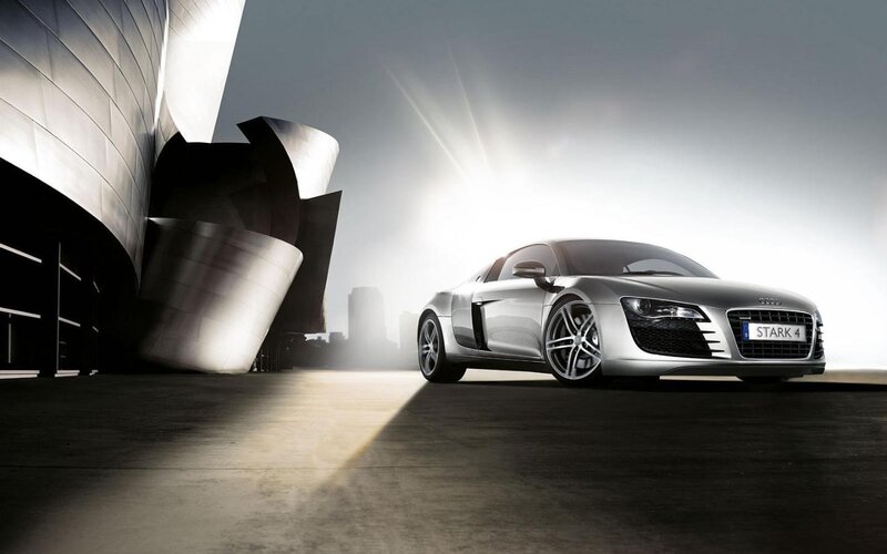Audi R8 in front of modern building