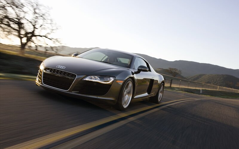 Audi R8 speeding on a road