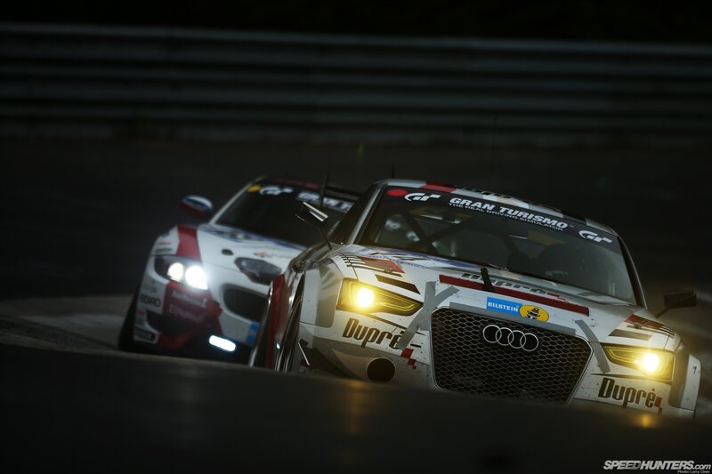 Audi race cars at night