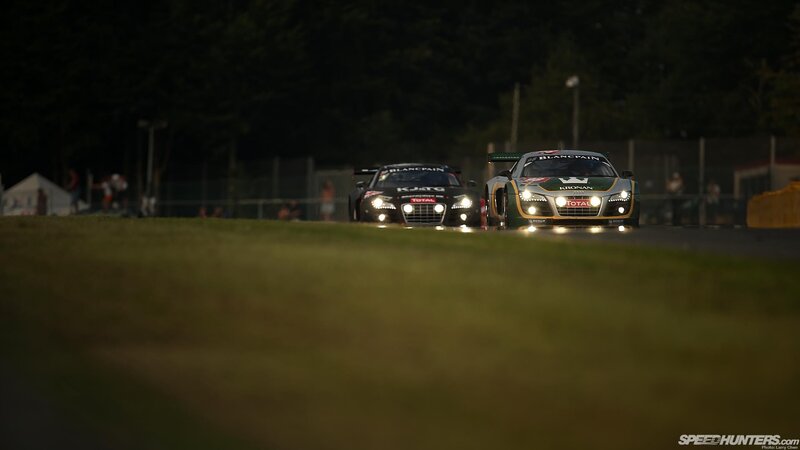 Audi race cars at night