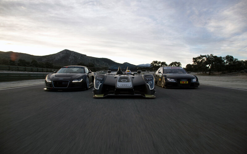 Audi race cars on a track