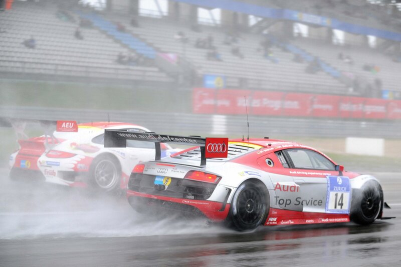 Audi race cars on wet track