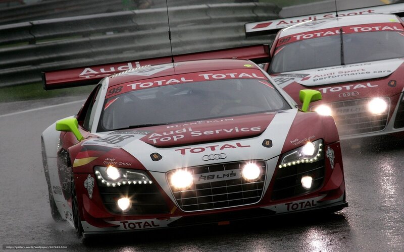 Audi race cars on wet track