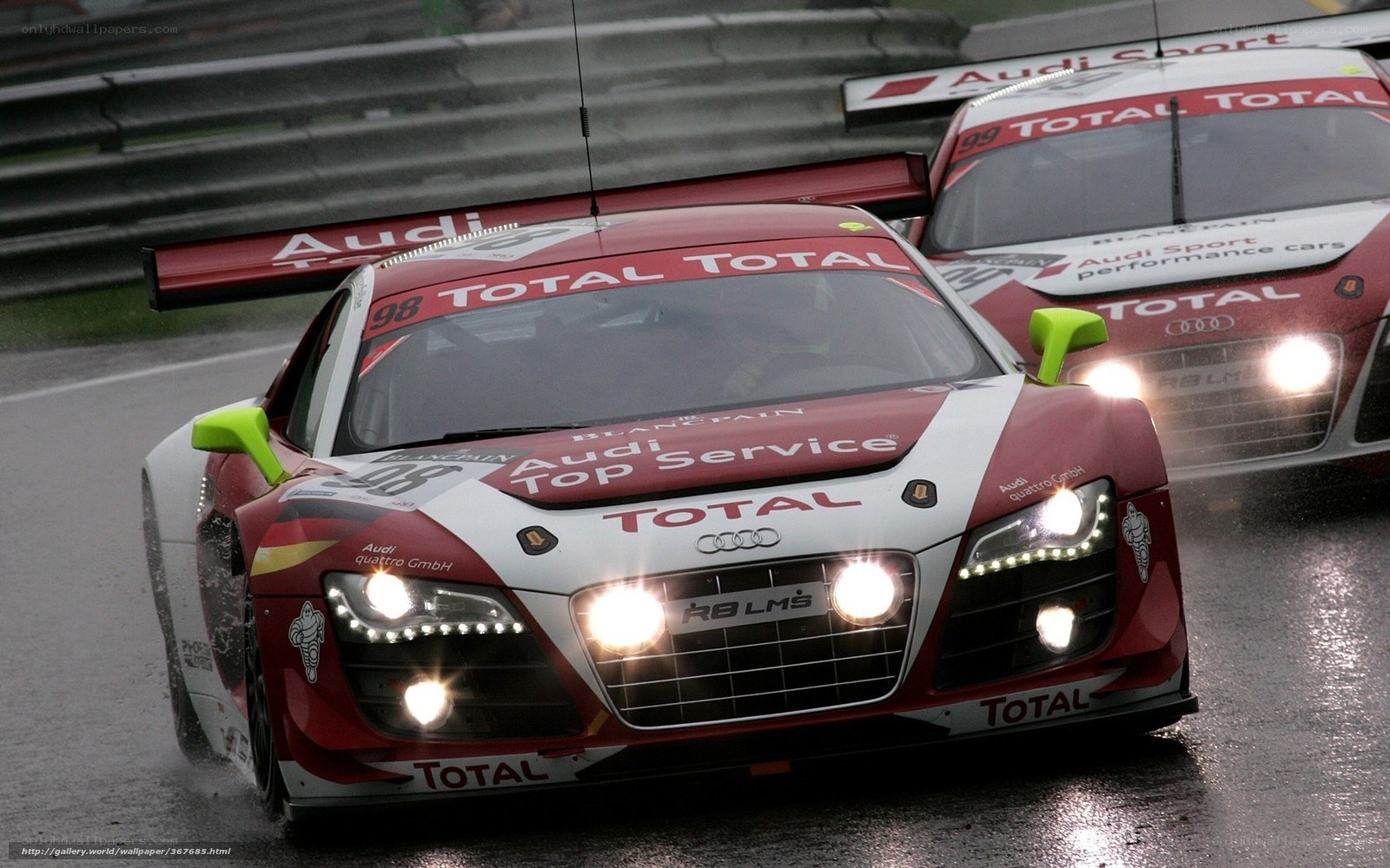 Audi race cars on wet track