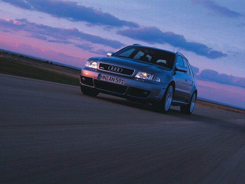 Audi RS4 on a road at dusk