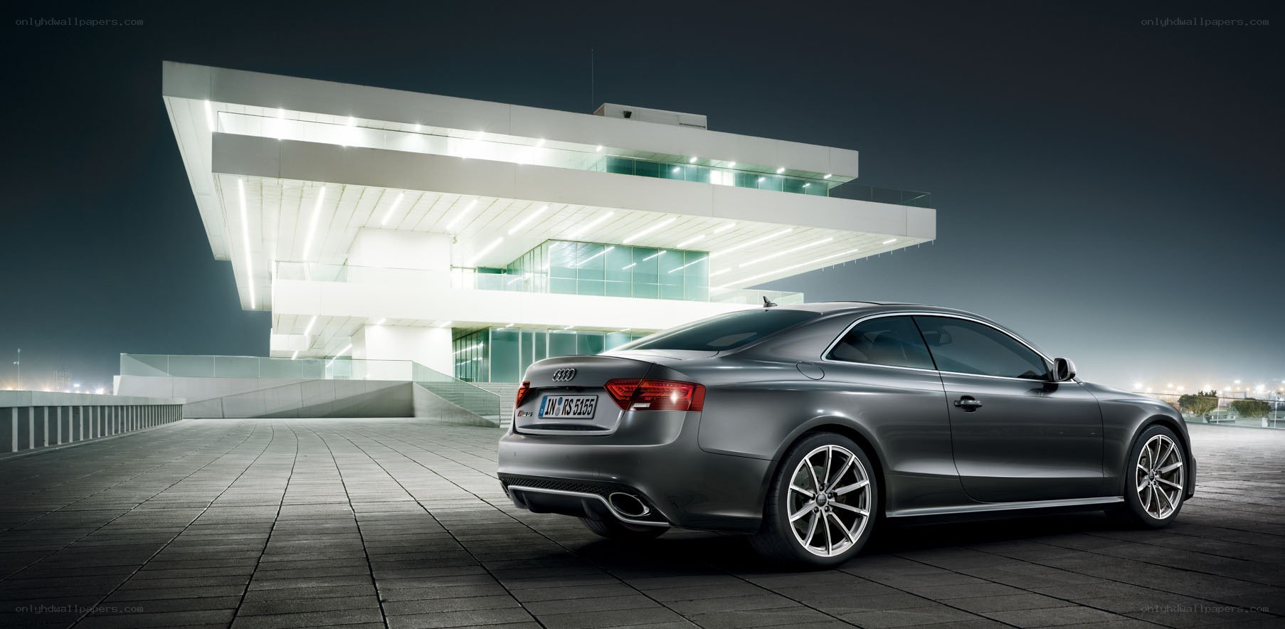 Audi RS5 at a modern building