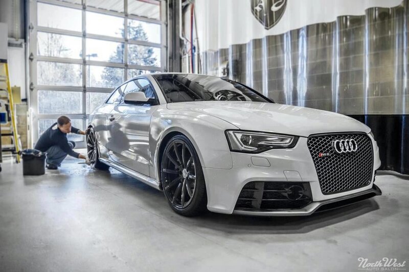 Audi RS5 being detailed in a garage
